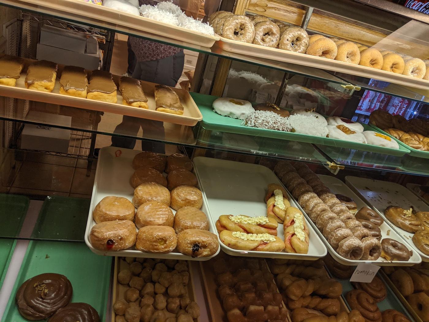 The display case at Papa Jake's, filled with iced long johns, coconut topped donuts, glazed and sugared rings, jelly filled donuts, cream filled twists and donut holes.